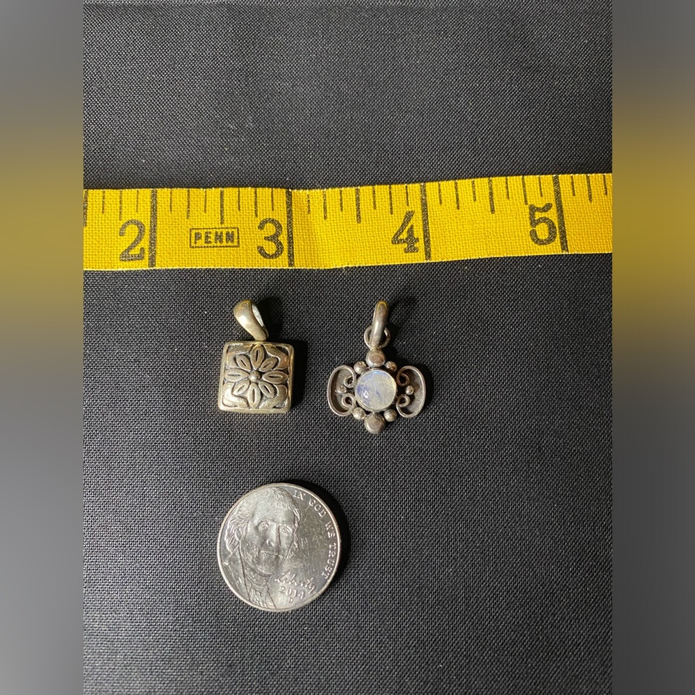Two pretty little sterling silver pendants